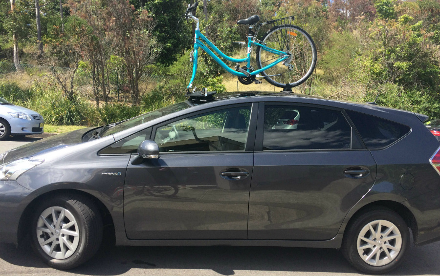 2016 Toyota Prius and SeaSucker Bomber mounted on the glass roof